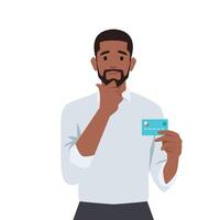 Young man thinking about using credit card. vector