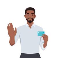 Serious man shows stop gesture and holding credit card. vector