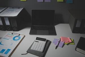 Studio workspace with laptop computer and office supplies. Work from home. With copy space photo