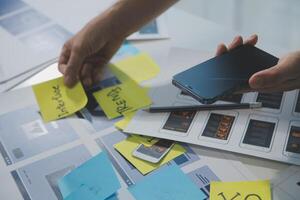 ux Graphic designer creative sketch planning application process development prototype wireframe for web mobile phone . User experience concept. photo