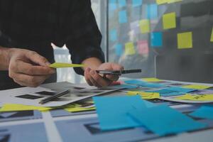 ux Graphic designer creative sketch planning application process development prototype wireframe for web mobile phone . User experience concept. photo