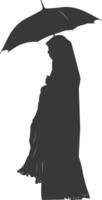 Silhouette independent emirates women wearing Abaya with umbrella black color only vector