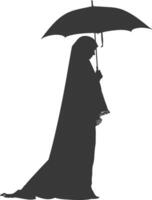 Silhouette independent emirates women wearing Abaya with umbrella black color only vector