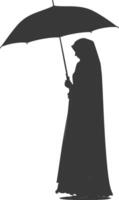 Silhouette independent emirates women wearing Abaya with umbrella black color only vector