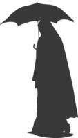 Silhouette independent emirates women wearing Abaya with umbrella black color only vector