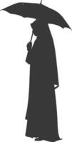 Silhouette independent emirates women wearing Abaya with umbrella black color only vector