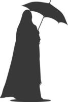 Silhouette independent emirates women wearing Abaya with umbrella black color only vector