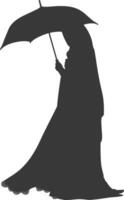 Silhouette independent emirates women wearing Abaya with umbrella black color only vector