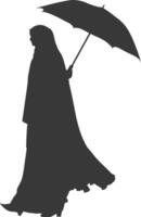 Silhouette independent emirates women wearing Abaya with umbrella black color only vector