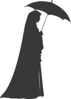 Silhouette independent emirates women wearing Abaya with umbrella black color only vector