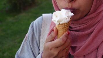 Female holds in her hand a cone with ice cream video