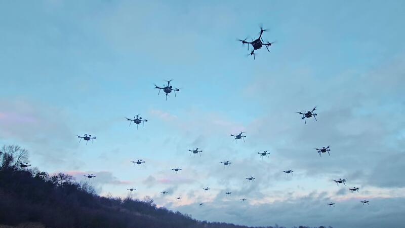 Keywords:
drones flying in formation - Swarm of Drones Flying at Dusk. A group of drones hovering in the ...