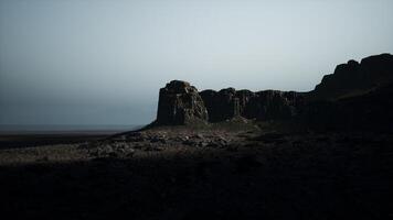 A rocky outcropping in the middle of the desert video