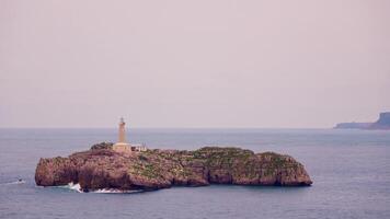 Beacon of safety. lighthouse on remote ocean island video