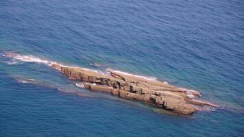 Aerial view of ocean rock outcropping video
