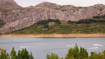 Mountain lake surrounded by trees video