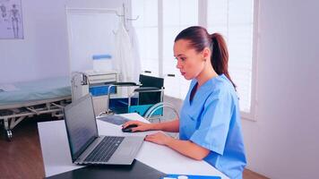 Nurse analysing list of patients on laptop, therapist typing on computer consult patient online. Medical physician in medicine uniform writing list of consulted, diagnosed patients, making research. video