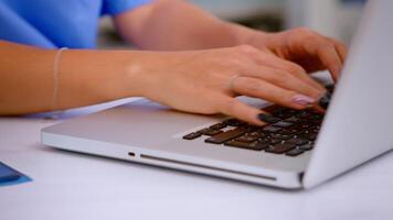 Close up of woman nurse typing patient health report on laptop keyboard making appointments in medical clinic, patient registration. Healthcare physician in medicine uniform writing treatments. video