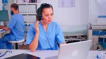 Professional health therapist prescribing treatments for patients during telehealth using headset, answering calls. Healthcare physician in medicine uniform, doctor nurse helping with appointment video