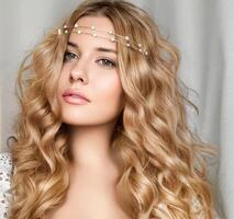 Beautiful bridal look, bride with long hair, wearing pearl tiara jewellery and beauty makeup, blonde woman with curly hairstyle, face portrait for wedding and fashion style photo