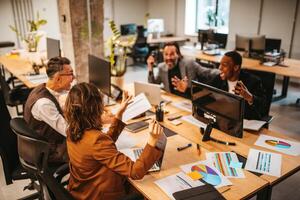 Business people in office work together during a meeting photo