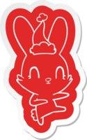 mignonne excentrique dessin animé autocollant de une lapin dansant portant Père Noël chapeau png