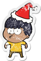 hand drawn distressed sticker cartoon of a curious boy wearing santa hat png