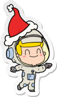 Fröhlicher Aufkleber-Cartoon eines Astronauten mit Weihnachtsmütze png