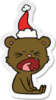 caricature d'autocollant en colère d'un ours portant un bonnet de noel png