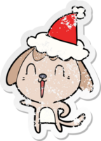 bonito desenho de adesivo angustiado de um cachorro usando chapéu de papai noel png