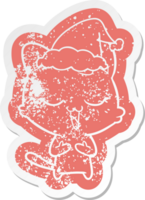 happy quirky cartoon distressed sticker of a cat wearing santa hat png