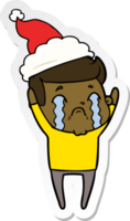 hand drawn sticker cartoon of a man crying wearing santa hat png