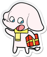 adesivo di un simpatico cartone animato elefante con regalo di Natale png