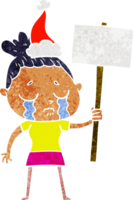 hand drawn retro cartoon of a crying woman with protest sign wearing santa hat png