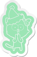 quirky cartoon  sticker of a cat wearing santa hat png