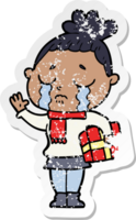 distressed sticker of a cartoon crying woman with christmas gift png