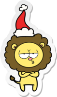 hand drawn sticker cartoon of a tired lion wearing santa hat png