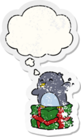 cartoon penguin on present with thought bubble as a distressed worn sticker png