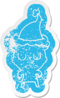 peaceful cartoon distressed sticker of a bear wearing santa hat png