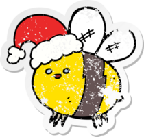 distressed sticker of a cute cartoon bee wearing christmas hat png