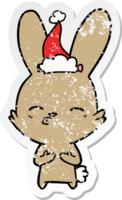 curious bunny distressed sticker cartoon of a wearing santa hat png