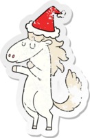 distressed sticker cartoon of a horse wearing santa hat png