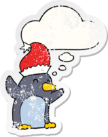 cute cartoon christmas penguin with thought bubble as a distressed worn sticker png