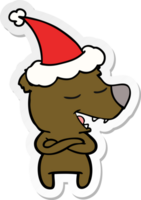 main tiré autocollant dessin animé de une ours portant Père Noël chapeau png