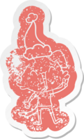 happy little dog cartoon distressed sticker of a wearing santa hat png