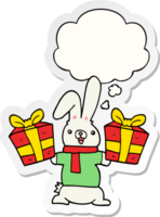 cartoon rabbit with christmas presents with thought bubble as a printed sticker png