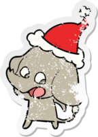 cute distressed sticker cartoon of a elephant wearing santa hat png