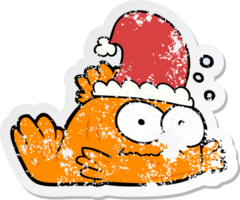 distressed sticker of a cartoon goldfish wearing xmas hat png