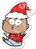 hand drawn distressed sticker cartoon of a bald man staring wearing santa hat png