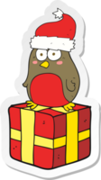 sticker of a cartoon robin on present png